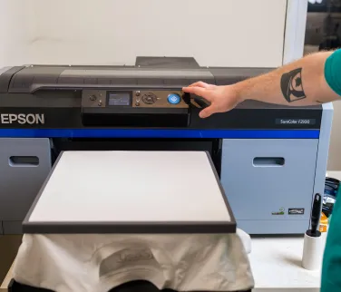 White t-shirt loaded onto a direct to garment clothing printer.