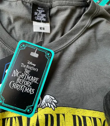 A printed licensed fashion t shirt with attached swing tag and neck label.